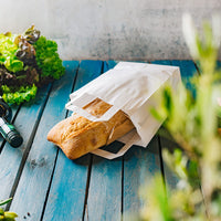 Papiertragetaschen weiß aus Kraftpapier mit Henkel